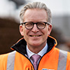 Individual Portrait of Michael Blach in an orange safety jacket (Photo)